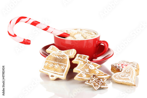 Photo: Cup of coffee with Christmas sweetness isolated on white Cup of coffee with Christmas sweetness isolated on white