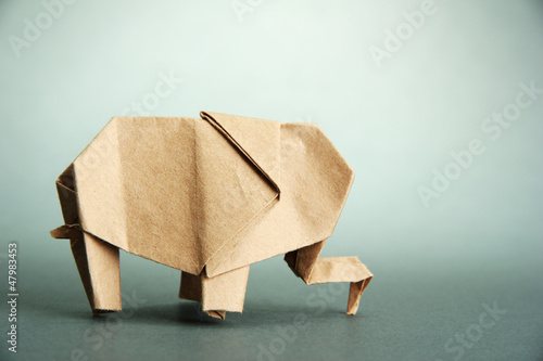 Photo: Origami elephant, on grey background Origami elephant, on grey background