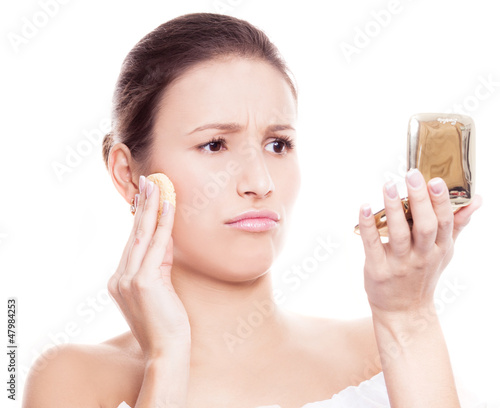 Photo: woman applying makeup woman applying makeup
