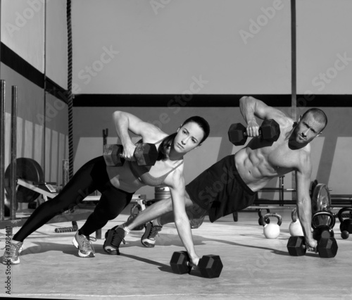 Photo: Gym man and woman push-up strength pushup Gym man and woman push-up strength pushup