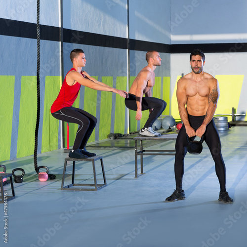 Photo: Crossfit box jump people group and kettlebell man Crossfit box jump people group and kettlebell man