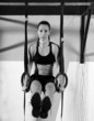 Crossfit dip ring woman workout at gym dipping