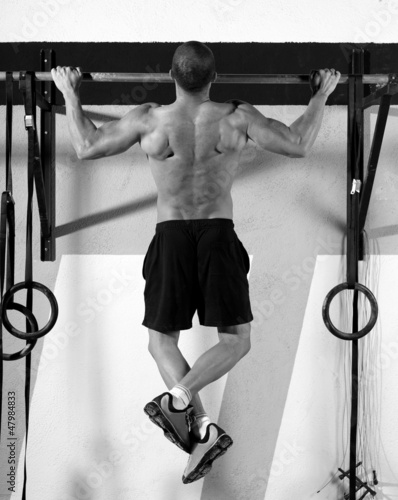 Photo: Crossfit toes to bar man pull-ups 2 bars workout Crossfit toes to bar man pull-ups 2 bars workout
