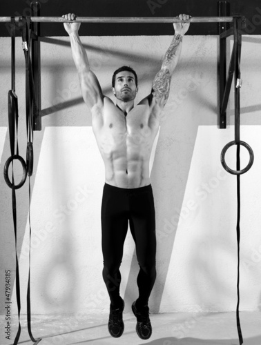 Photo: Crossfit toes to bar man pull-ups 2 bars workout Crossfit toes to bar man pull-ups 2 bars workout