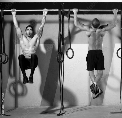Photo: Crossfit toes to bar men pull-ups 2 bars workout Crossfit toes to bar men pull-ups 2 bars workout