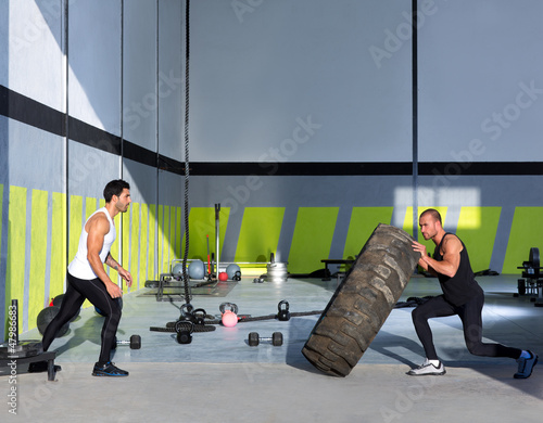 Photo: Crossfit flip tires men flipping each other Crossfit flip tires men flipping each other
