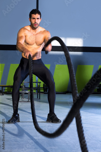 Photo: Crossfit battling ropes at gym workout exercise Crossfit battling ropes at gym workout exercise