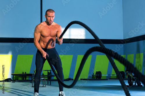 Photo: Crossfit battling ropes at gym workout exercise Crossfit battling ropes at gym workout exercise
