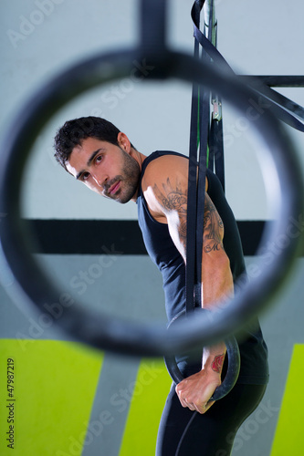 Photo: Crossfit dip ring man workout at gym Crossfit dip ring man workout at gym