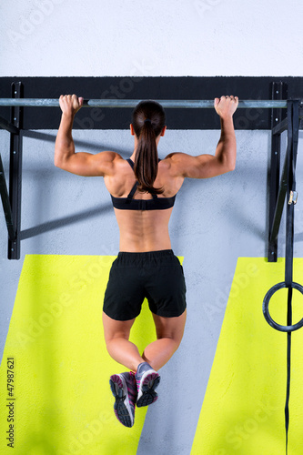 Photo: Crossfit toes to bar woman pull-ups 2 bars workout Crossfit toes to bar woman pull-ups 2 bars workout
