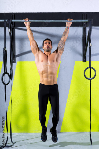 Photo: Crossfit toes to bar man pull-ups 2 bars workout Crossfit toes to bar man pull-ups 2 bars workout