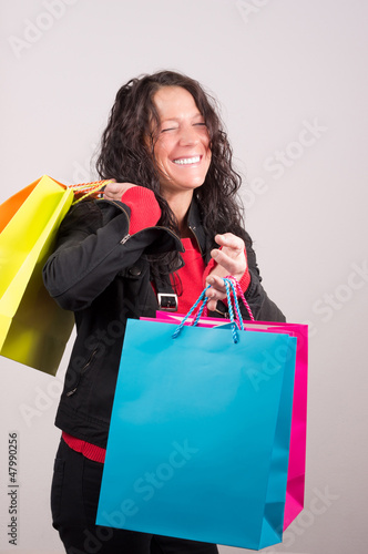 Photo: Laughing Woman with shopping Bags Laughing Woman with shopping Bags