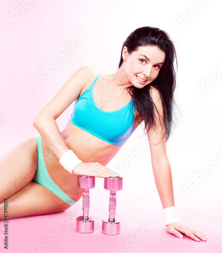 Photo: woman with dumbbells woman with dumbbells
