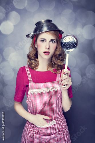 Photo: Redhead housewife with soup ladle Redhead housewife with soup ladle