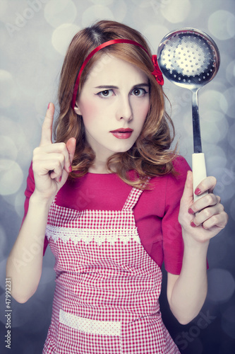 Photo: Redhead housewife with soup ladle Redhead housewife with soup ladle