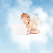 Photo: little angel with laptop computer little angel with laptop computer