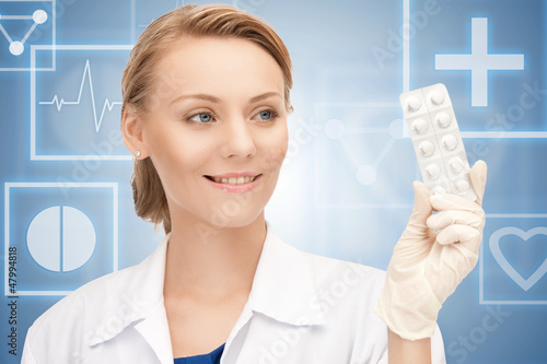 Photo: attractive female doctor with pills attractive female doctor with pills