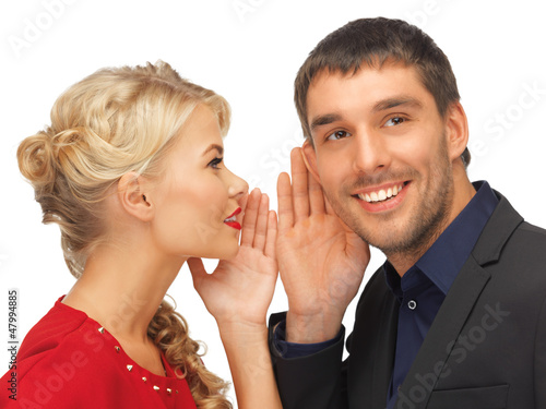 Photo: man and woman spreading gossip man and woman spreading gossip