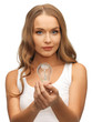 woman with energy saving bulb