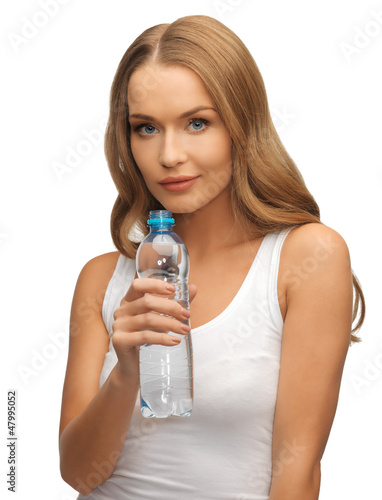 Photo: young beautiful woman with bottle of water young beautiful woman with bottle of water