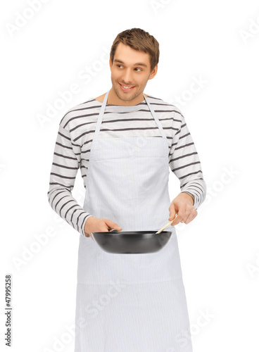 Photo: handsome man with pan and spoon handsome man with pan and spoon