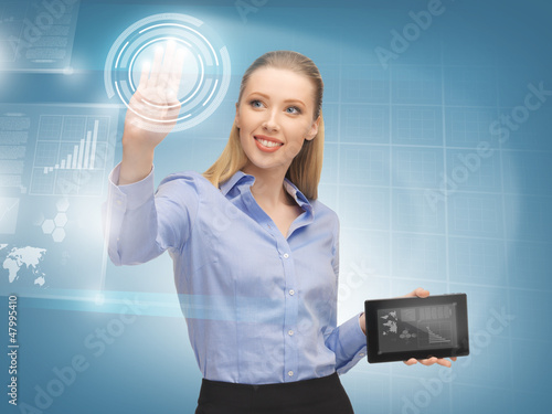 Photo: woman working with virtual tablet pc woman working with virtual tablet pc
