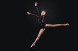 Young woman in gymnast suit posing