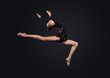 Young woman in gymnast suit posing
