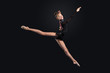 Young woman in gymnast suit posing