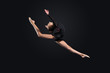 Young woman in gymnast suit posing