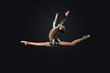 Young woman in gymnast suit posing
