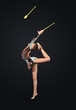 Young woman in gymnast suit posing
