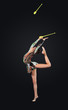 Young woman in gymnast suit posing