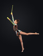 Young woman in gymnast suit posing