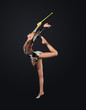 Young woman in gymnast suit posing