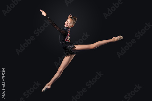 Photo: Young woman in gymnast suit posing Young woman in gymnast suit posing