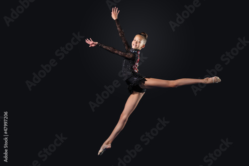 Photo: Young woman in gymnast suit posing Young woman in gymnast suit posing