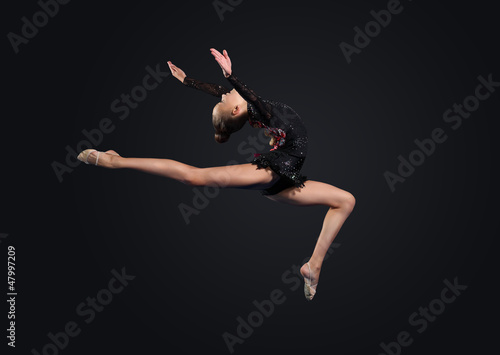 Photo: Young woman in gymnast suit posing Young woman in gymnast suit posing
