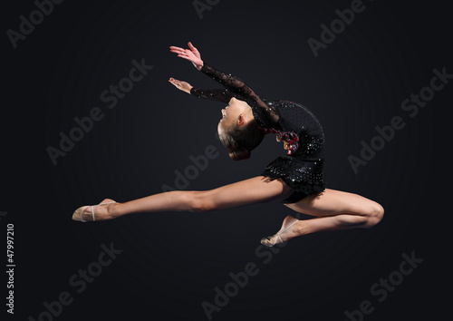 Photo: Young woman in gymnast suit posing Young woman in gymnast suit posing