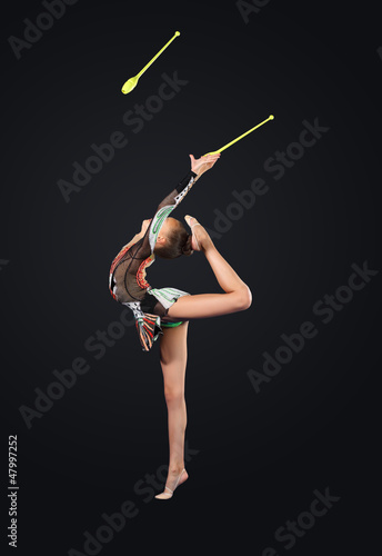 Photo: Young woman in gymnast suit posing Young woman in gymnast suit posing