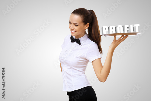 Photo: Waitress holding a tray with word profit Waitress holding a tray with word profit