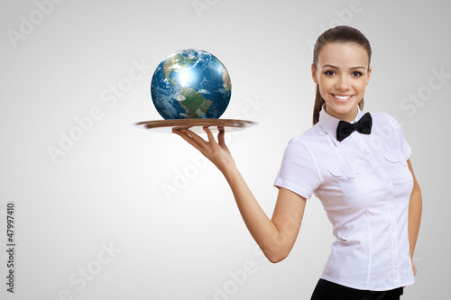 Photo: Waitress with a tray with green symbol on it Waitress with a tray with green symbol on it