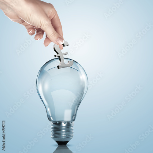 Photo: Money inside an electric light bulb Money inside an electric light bulb