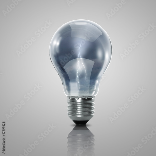 Photo: Electric light bulb and a plant inside it Electric light bulb and a plant inside it