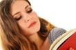 Young woman reading a book isolated on white
