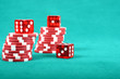 Poker gambling chips on a green playing table