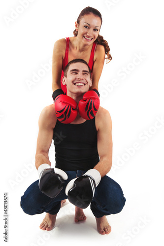 Photo: Couple portrait with boxing gloves on white background. Couple portrait with boxing gloves on white background.