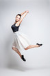 Modern style dancer posing on studio background 