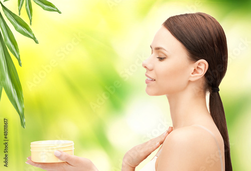 Photo: beautiful woman with moisturizing creme beautiful woman with moisturizing creme