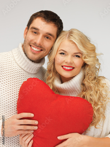 Photo: family couple in a sweaters with heart family couple in a sweaters with heart